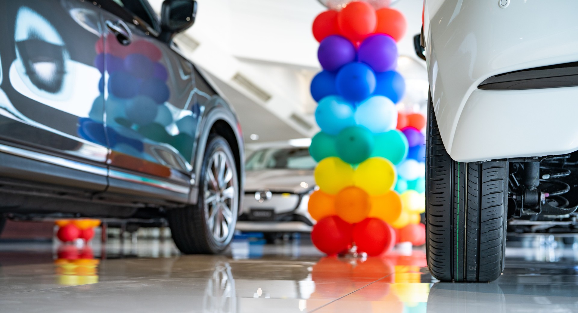 Car parked in luxury showroom. Car dealership office. Car showroom business. New car parked in modern showroom. Auto for sale and rent business. Automobile leasing and insurance. Electric automobile.