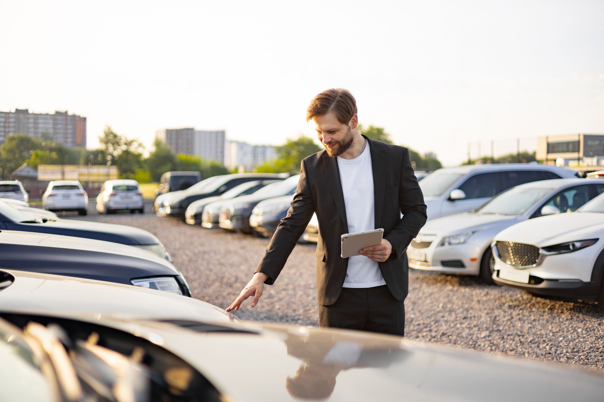 Car Salesman Inspecting a Vehicle